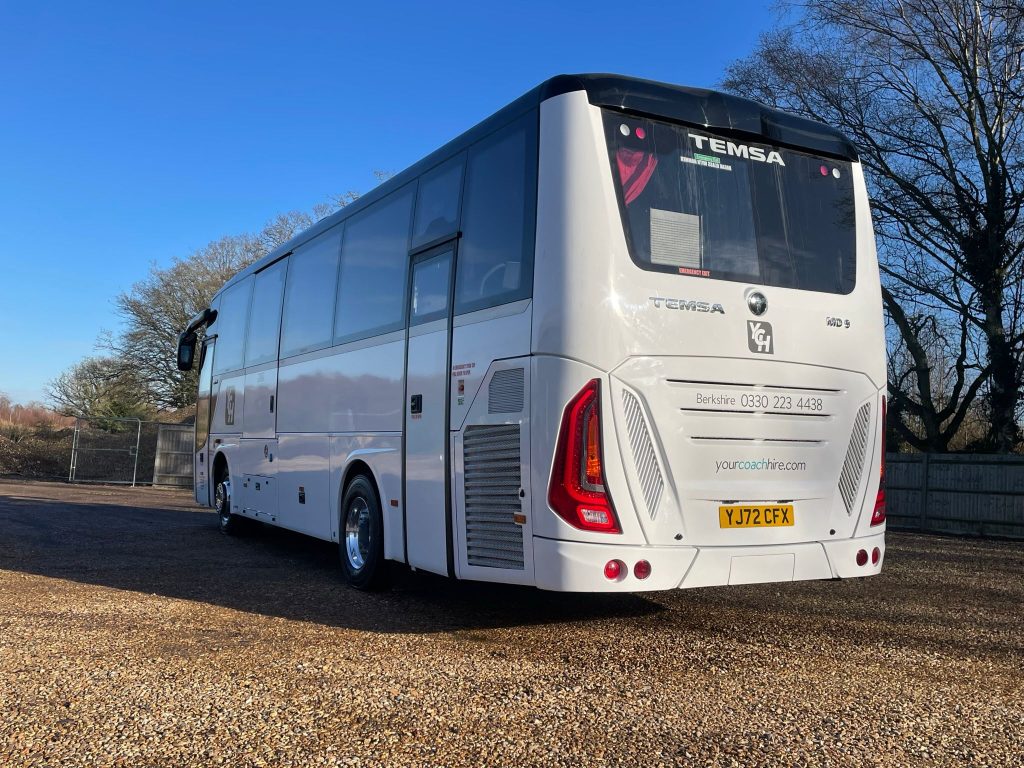 rear view of a white 34 seater executive coach with Your Coach Hire logo on the back