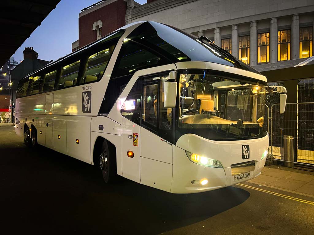 VIP coach on a nighttime street