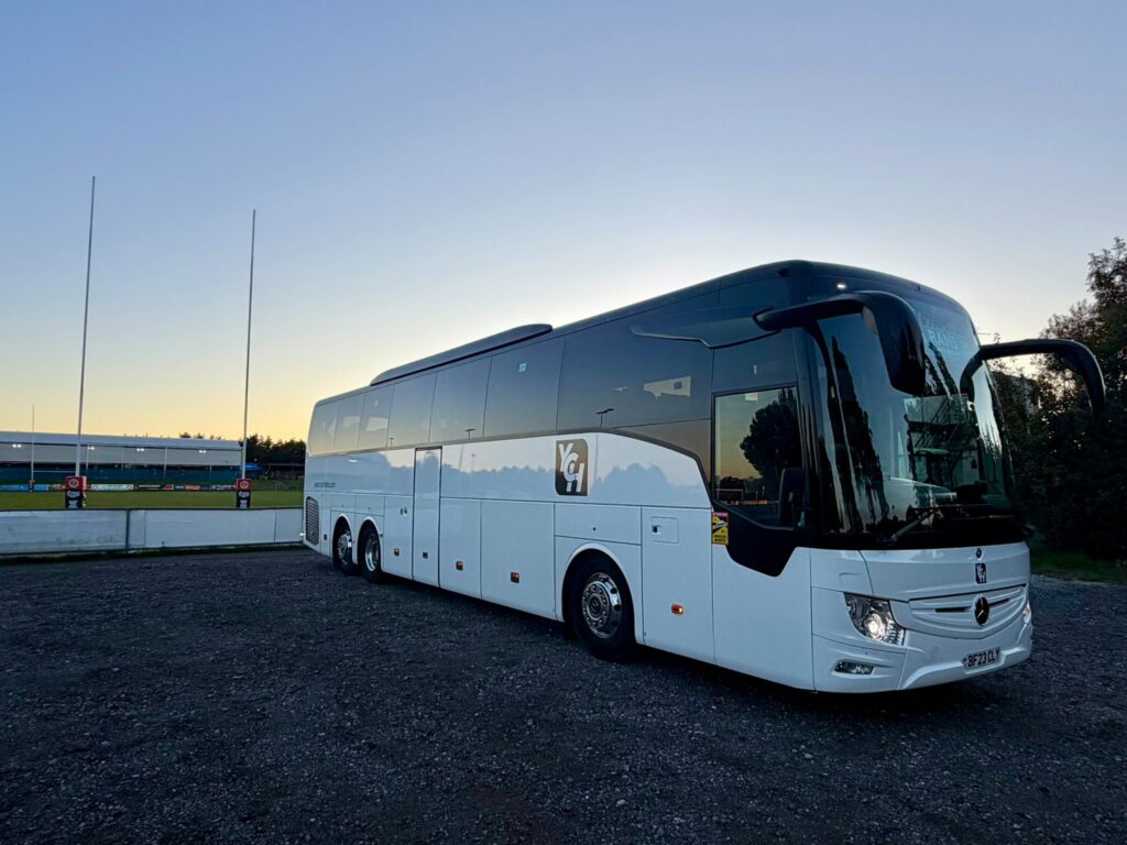 coach ready to transport sports team home from fixture